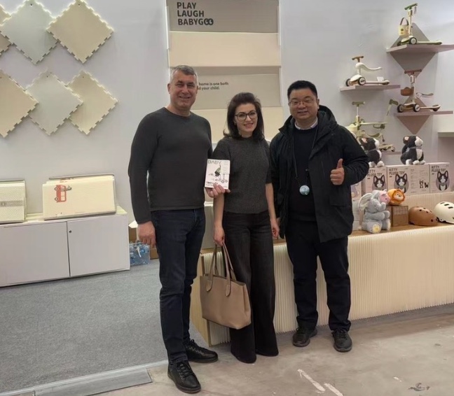 Michael Chen with two visitors at the BABYGO booth during Kids' Time Kielce 2026