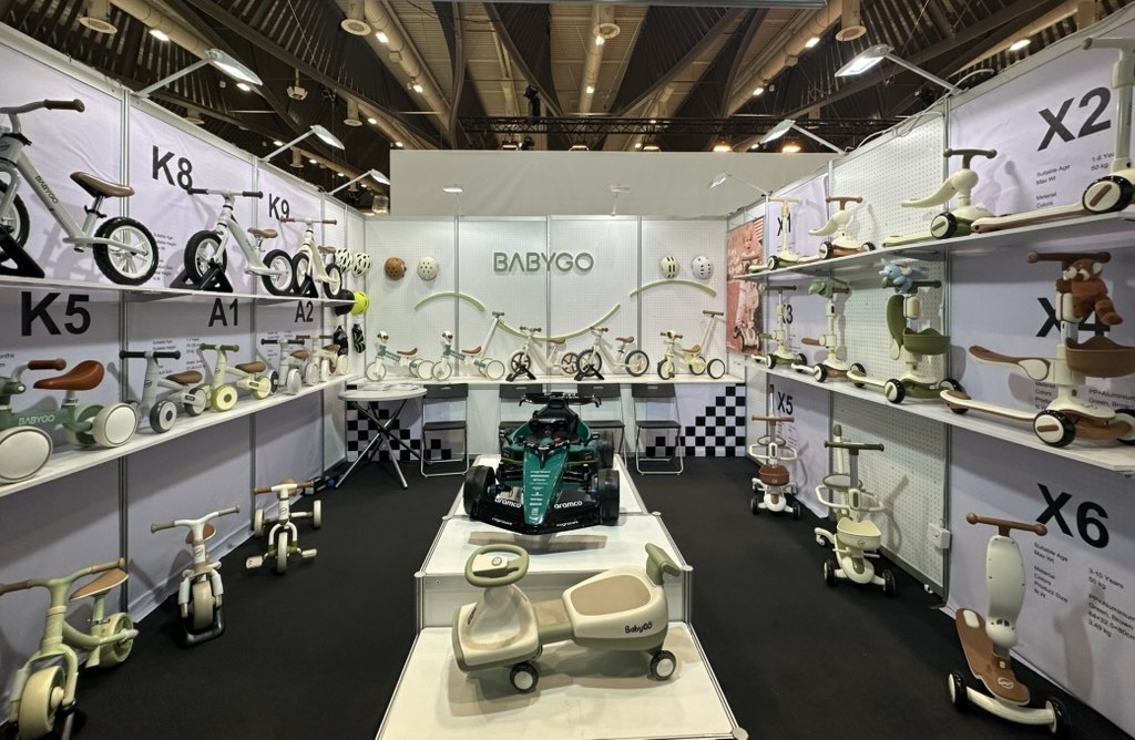 BABYGO ride-on toy booth at the 2025 Nuremberg Toy Fair with the company sign cropped out
