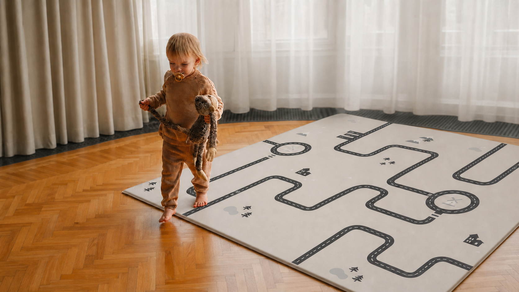 Child standing beside a full premium TPU play mat with a Nordic road pattern