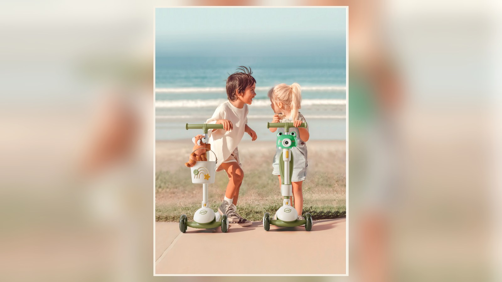 Two children with green X1 scooters beside the sea
